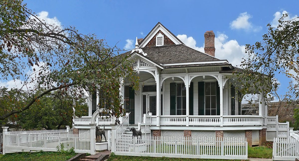 Historic Heritage Society houses among shaded lawns in Sam Houston Park downtown