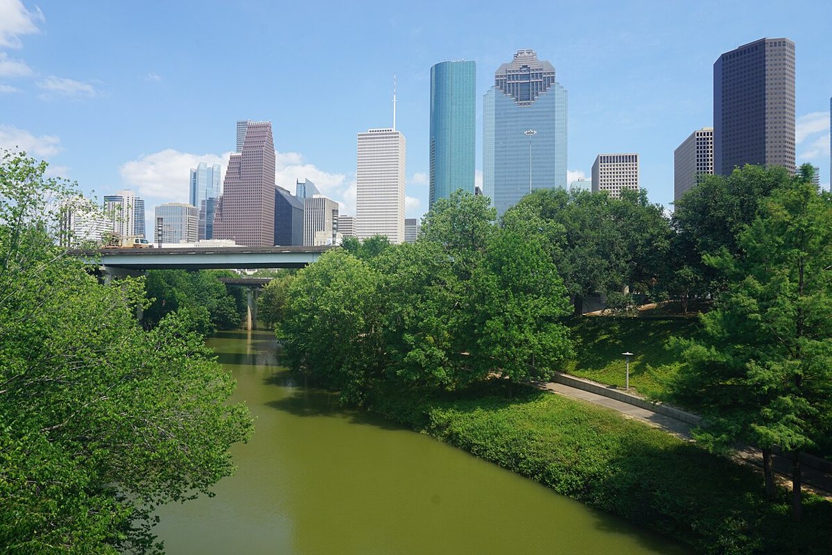 Buffalo Bayou Park trail with downtown Houston skyline in spring